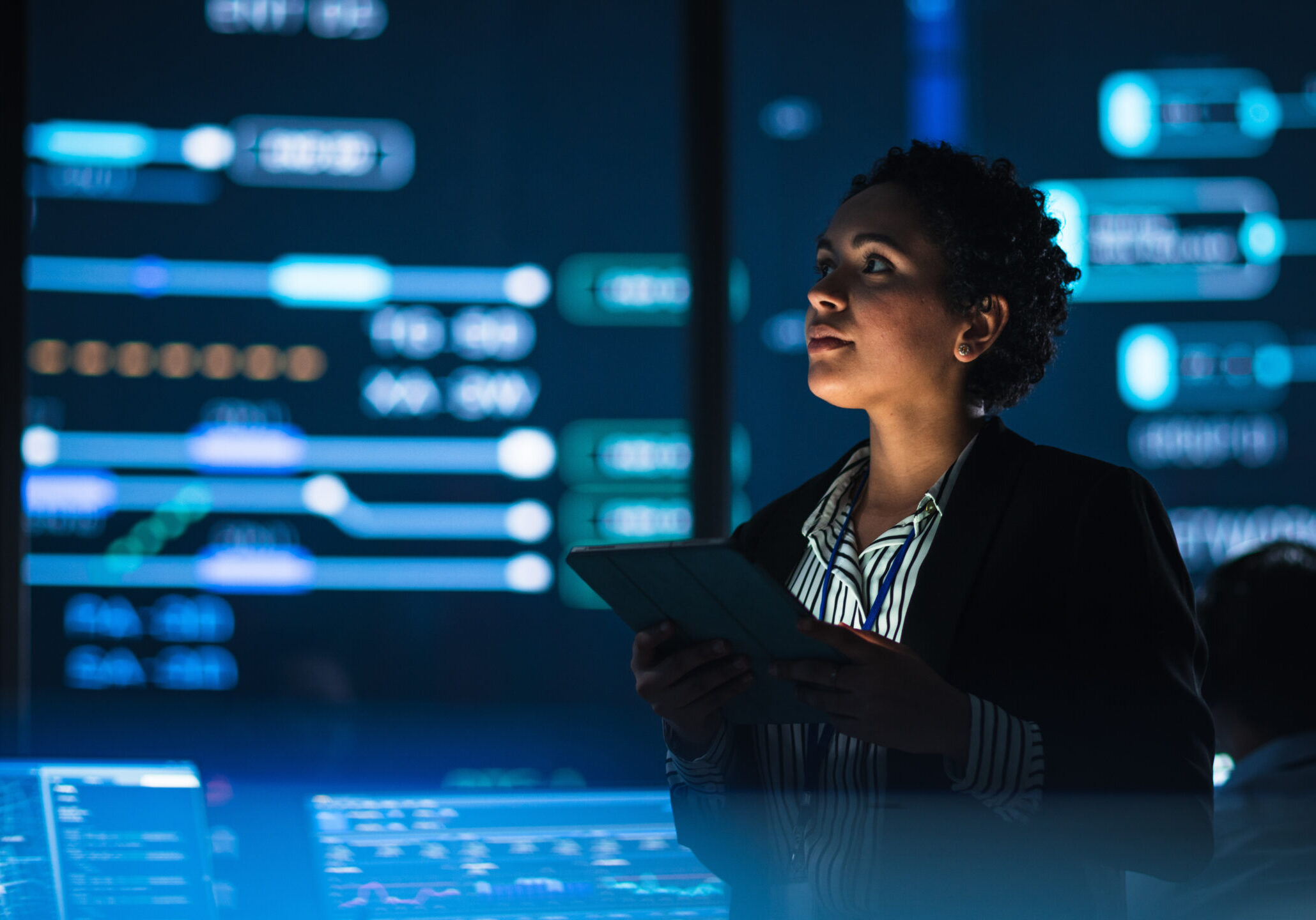 Young Multiethnic Female Government Employee Uses Tablet Compute Technical Staffing